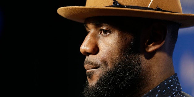 Cleveland Cavaliers forward LeBron James listens to a question during a news conference following Game 6 of basketball's NBA