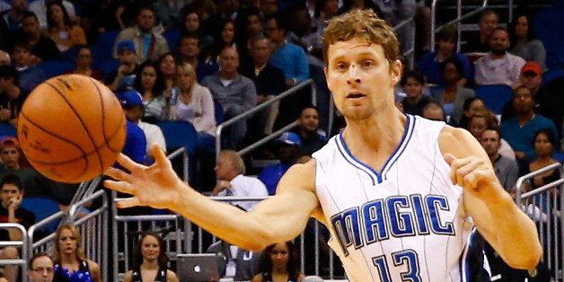 ORLANDO, FL - NOVEMBER 14: Luke Ridnour #13 of the Orlando Magic attempts a pass during the game against the Milwaukee Bucks at Amway Center on November 14, 2014 in Orlando, Florida. The Magic won the game 101-85. NOTE TO USER: User expressly acknowledges and agrees that, by downloading and/or using this Photograph, user is consenting to the terms and conditions of the Getty Images License Agreement. (Photo by Sam Greenwood/Getty Images)