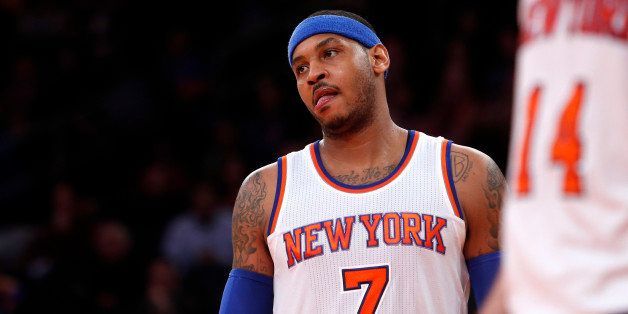 New York Knicks' Carmelo Anthony (7) reacts during the third quarter of an NBA basketball game against the Orlando Magic Friday, Jan. 23, 2015, in New York. New York defeated Orlando 113-106. (AP Photo/Jason DeCrow)