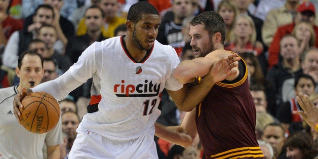 PORTLAND, OR - NOVEMBER 04: LaMarcus Aldridge #12 of the Portland Trail Blazers battles for position with Kevin Love #0 of th