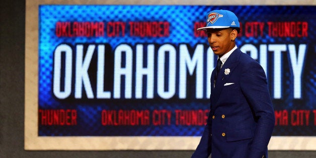 NEW YORK, NY - JUNE 25: Cameron Payne leaves the stage after being selected 14th overall by the Oklahoma City Thunder in the