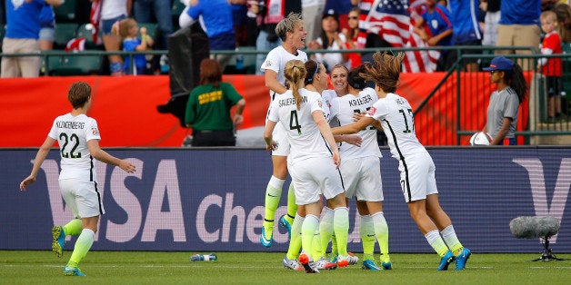 EDMONTON, AB - JUNE 22: Alex Morgan #13 and Abby Wambach #20 of the United States celebrate after Morgan scores her first go