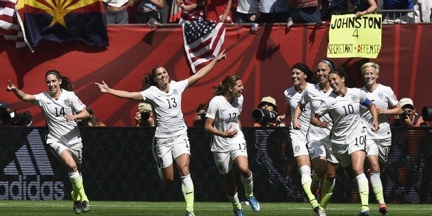 USA midfielder Carli Lloyd (10) celebrates her goal with teammates during the final football match between USA and Japan during their 2015 FIFA Women's World Cup at the BC Place Stadium in Vancouver on July 5, 2015. AFP PHOTO / FRANCK FIFE (Photo credit should read FRANCK FIFE/AFP/Getty Images)