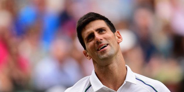 LONDON, ENGLAND - JULY 12: Novak Djokovic of Serbia reacts in the Final Of The Gentlemen's Singles against Roger Federer of Switzerland on day thirteen of the Wimbledon Lawn Tennis Championships at the All England Lawn Tennis and Croquet Club on July 12, 2015 in London, England. (Photo by Shaun Botterill/Getty Images)