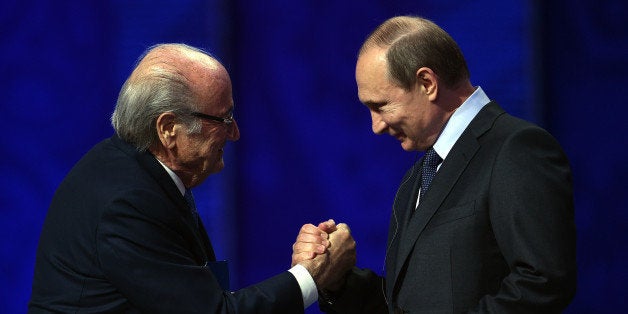 SAINT PETERSBURG, RUSSIA - JULY 25: FIFA President Joseph S. Blatter shakes hands with Vladimir Putin, President of Russia during the Preliminary Draw of the 2018 FIFA World Cup in Russia at The Konstantin Palace on July 25, 2015 in Saint Petersburg, Russia. (Photo by Dennis Grombkowski/Getty Images)