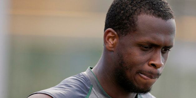 New York Jets quarterback Geno Smith talks to members of the media after practice at the team's NFL football training camp, Saturday, Aug. 1, 2015, in Florham Park, N.J. (AP Photo/Julie Jacobson)