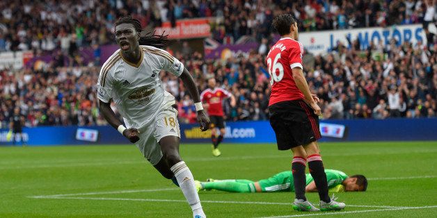 SWANSEA, WALES - AUGUST 30: Swansea striker Bafetimbi Gomis celebrates after scoring the second swansea goal during the Barclays Premier League match between Swansea City and Manchester United on August 30, 2015 in Swansea, United Kingdom. (Photo by Stu Forster/Getty Images)