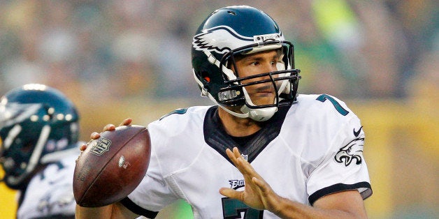 Philadelphia Eagles quarterback Sam Bradford drops back to pass during the first half of an NFL football game against the Gre
