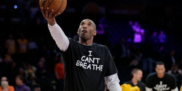 Los Angeles Lakers' Kobe Bryant warms up before an NBA basketball game against the Sacramento Kings, Tuesday, Dec. 9, 2014, in Los Angeles. Several athletes have worn "I Can't Breathe" shirts during warm ups in support of the family of Eric Garner, who died July 17 after a police officer placed him in a chokehold when he was being arrested for selling loose, untaxed cigarettes. (AP Photo/Jae C. Hong)