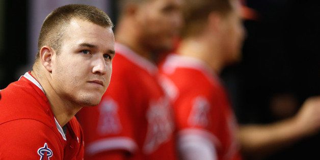 OAKLAND, CA - SEPTEMBER 01: Mike Trout #27 of the Los Angeles Angels of Anaheim sits in the dugout during their game against the Oakland Athletics at O.co Coliseum on September 1, 2015 in Oakland, California. (Photo by Ezra Shaw/Getty Images)