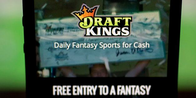 The DraftKings Inc. app is arranged for a photograph on an Apple Inc. iPhone in Washington, D.C., U.S., on Sunday, Oct. 4, 2015. Fantasy sports companies DraftKings Inc. and FanDuel Inc. raised a total of $575 million in July from investors including KKR & Co., 21st Century Fox Inc. and Major League Baseball to attract players to games that pay out millions of dollars in cash prizes in daily contests. Photographer: Andrew Harrer/Bloomberg via Getty Images