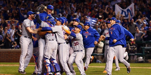 CHICAGO, IL - OCTOBER 21: The New York Mets celebrate an 8-3 victory in Game 4 of the NLCS against the Chicago Cubs at Wrigl