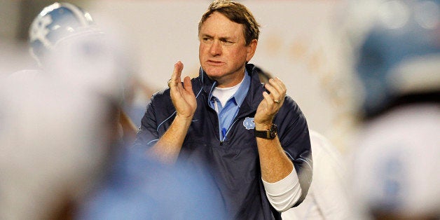 MIAMI, FL - OCTOBER 23: Head coach Butch Davis of the North Carolina Tar Heels gets his team ready for the game against the M