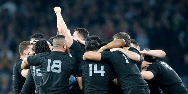 New Zealand players celebrate after winning the Rugby World Cup final between New Zealand and Australia at Twickenham Stadium