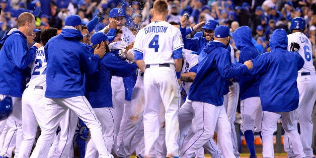 KANSAS CITY, MO - OCTOBER 27: Members of the Kansas City Royals celebrate defeating the New York Mets in Game 1 of the 2015 World Series at Kauffman Stadium on Tuesday, October 27, 2015 in Kansas City, Missouri. (Photo by Ron Vesely/MLB Photos via Getty Images)