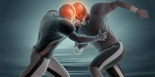 Two American football players colliding, with both brains visible through helmets.