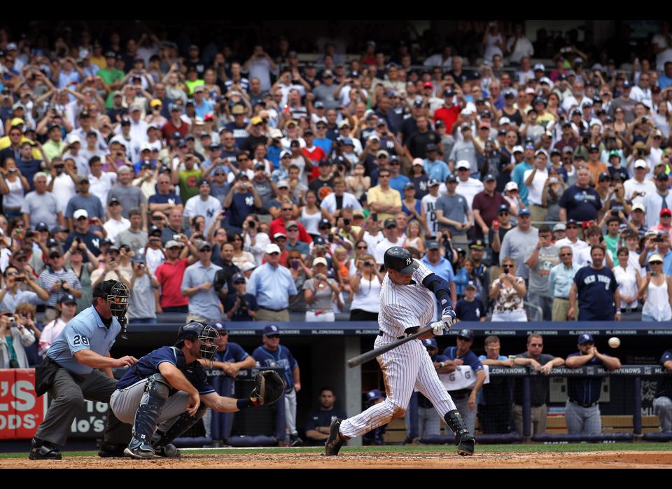 New York Yankees Derek Jeter pumps his fist after hitting a game winning 3  run homer at Yankees Stadium in New York City on April 11, 2006. The New  York Yankees defeated