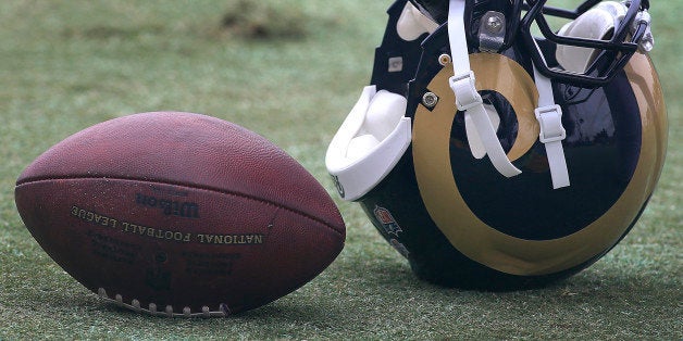 OXNARD, CALIF. -- MONDAY, AUGUST 17, 2015: Detail shot of gloves used by St. Louis Rams running back Todd Gurley during the Dallas Cowboys scrimmage against the St. Louis Rams. The Rams are making an appearance in Southern California now that they're trying to possibly move back. Photo taken in Oxnard, Calif., on Aug. 17, 2015. (Allen J. Schaben / Los Angeles Times)