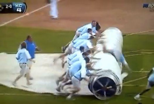 LOOK: KC grounds crew member gets rolled by tarp at ALDS