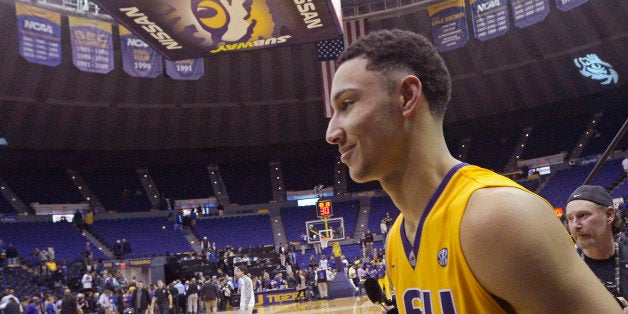 LSU forward Ben Simmons, of Australia, smiles while leaving the court after LSU defeated Kentucky 85-67 in an NCAA college b