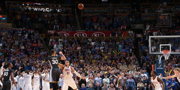 OKLAHOMA CITY, OK - FEBRUARY 27: Stephen Curry #30 of the Golden State Warriors hits the winning shot against Andre Roberson #21 of the Oklahoma City Thunder on February 27, 2016 at Chesapeake Energy Arena in Oklahoma City, Oklahoma. NOTE TO USER: User expressly acknowledges and agrees that, by downloading and or using this photograph, User is consenting to the terms and conditions of the Getty Images License Agreement. Mandatory Copyright Notice: Copyright 2016 NBAE (Photo by Joe Murphy/NBAE via Getty Images)