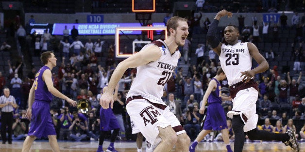 Texas A&M guard Alex Caruso, left, and guard Danuel House (23) celebrate as Northern Iowa players walk off the court after defeating Northern Iowa in double overtime of a second-round men's college basketball game in the NCAA Tournament Sunday, March 20, 2016, in Oklahoma City. Texas A&M won 92-88. (AP Photo/Sue Ogrocki)