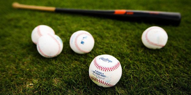 JUPITER, FL - FEBRUARY 23: Baseballs and a bat sit on the field of the Miami Marlins during a team workout on February 23, 2016 in Jupiter, Florida. (Photo by Rob Foldy/Getty Images)