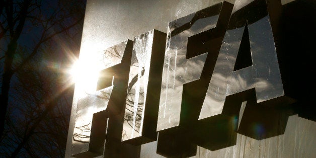 The sun is reflected in FIFA's logo in front of FIFA's headquarters in Zurich, Switzerland November 19, 2015. The head of the Russia 2018 World Cup says Swiss and U.S investigations have not even been in contact and that the competition will go ahead in the country, regardless of what critics may say. FIFA's awarding of 2018 to Russia and the 2022 World Cup to Qatar is one of the strands under scrutiny from U.S. and Swiss authorities investigating corruption in the organization. REUTERS/Arnd Wiegmann