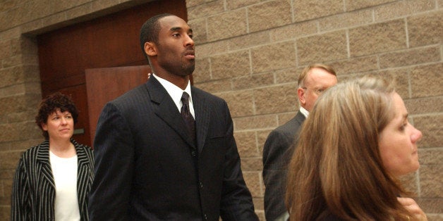 EAGLE, CO - JULY 30: Los Angeles Lakers star Kobe Bryant (2nd-L) along with his attorney Pamela Mackey, investigator Rivka Morgan Sherman (L) and security Ed Killam leave the Eagle County Justice Center court room July 30, 2004 in Eagle, Colorado. On July 29, the court released documents that showed the woman accusing Bryant of rape received approximately $20,000 from a victim's compensation fund. (Photo by Karl Gehring-Pool/Getty Images)