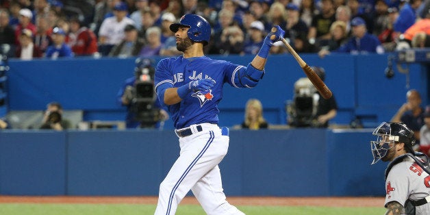 TORONTO, CANADA - APRIL 9: Jose Bautista #19 of the Toronto Blue Jays hits a two-run home run in the first inning during MLB