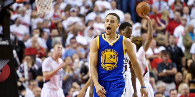 Golden State Warriors guard Stephen Curry reacts after scoring a basket against the Portland Trail Blazers during the second half of Game 4 of an NBA basketball second-round playoff series Monday, May 9, 2016, in Portland, Ore. The Warriors won 132-125. (AP Photo/Craig Mitchelldyer)