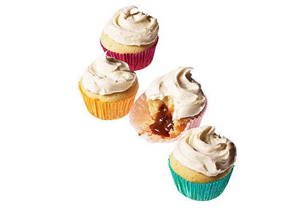 Instead of jazzing up a basic vanilla cupcake with frosting or filling, this outrageous recipe has you swirling caramel sauce