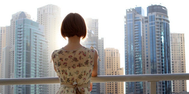 Woman looking at city.