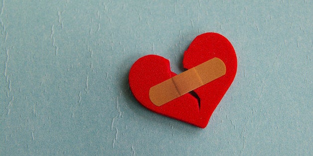 broken heart with a bandage on ...