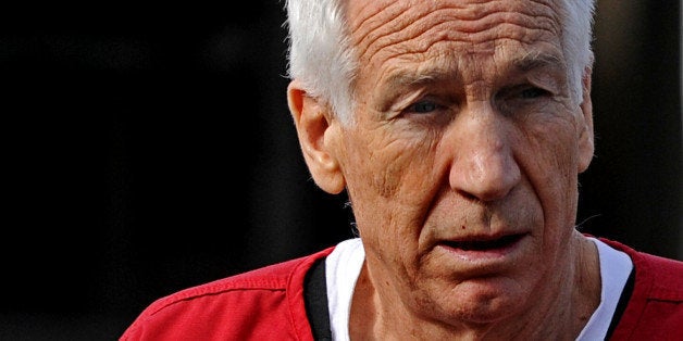 BELLEFONTE, PA - OCTOBER 09: Former Penn State assistant football coach Jerry Sandusky leaves the Centre County Courthouse after being sentenced in his child sex abuse case on October 9, 2012 in Bellefonte, Pennsylvania. The 68-year-old Sandusky was sentenced to at least 30 years and not more that 60 years in prison for his conviction in June on 45 counts of child sexual abuse, including while he was the defensive coordinator for the Penn State college football team. (Photo by Patrick Smith/Getty Images)