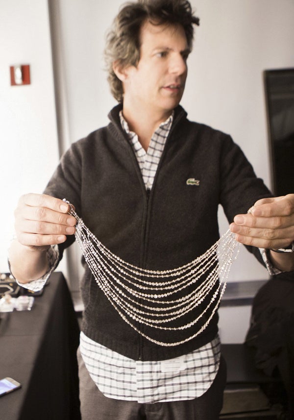 <em>O </em>creative director Adam Glassman peruses necklace options.