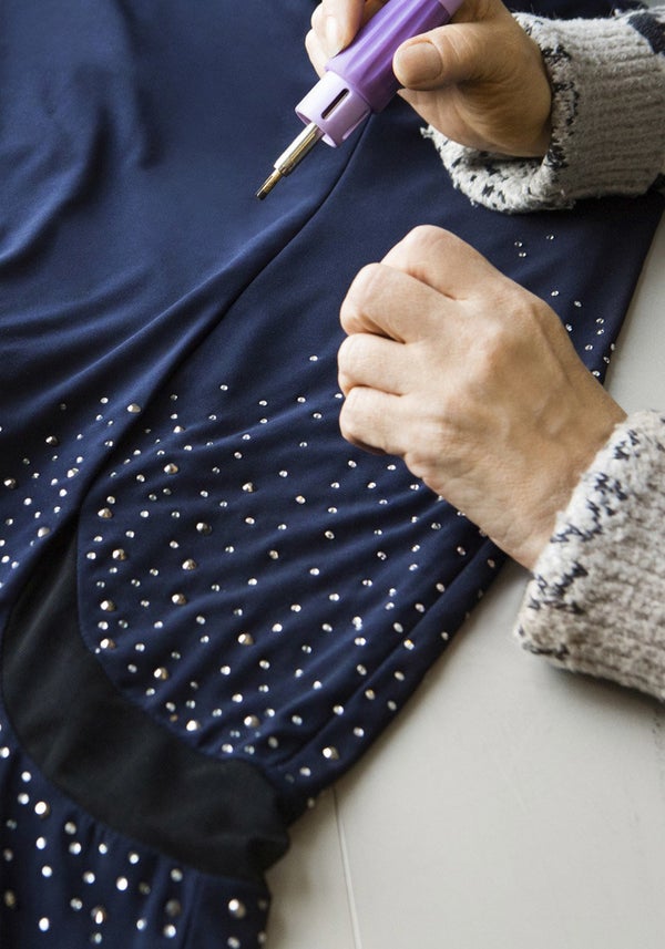 Cmylo amps up the wattage of Oprah's on-trend navy gown by adding Swarovski crystals.