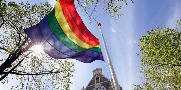 Rainbow flag flies in the mast at Homomonument in front of the Wester Church in Amsterdam,Netherlands.