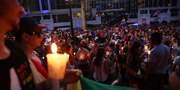 ORLANDO, FL - JUNE 19: People attend a memorial service on June 19, 2016 in Orlando, Florida. Thousands of people are expecte