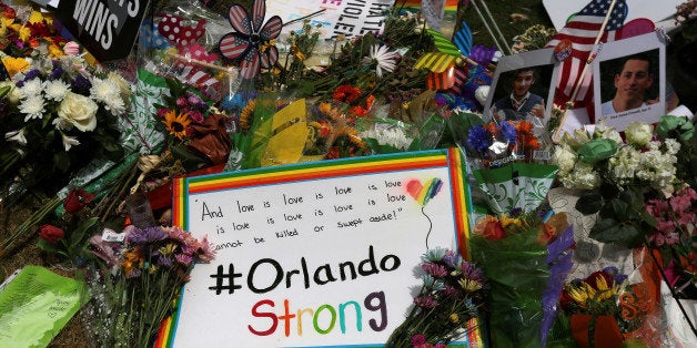 An #OrlandoStrong sign is left at a makeshift memorial for the victims of the Pulse night club shooting in Orlando, Florida,