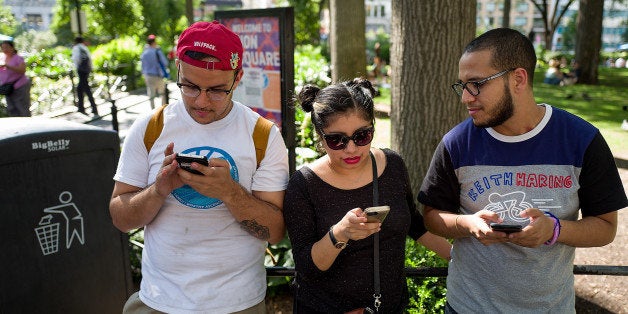 NEW YORK, NY - JULY 11: A group of friends play Pokemon Go on their smartphones at Union Square, July 11, 2016 in New York City. The success of Nintendo's new smartphone game, Pokemon Go, has sent shares of Nintendo soaring. (Photo by Drew Angerer/Getty Images)