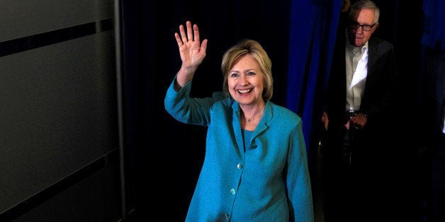 Democratic U.S. presidential nominee Hillary Clinton arrives with Senate Minority Leader Harry Reid (D-NV) for a rally at the