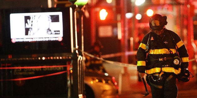 NEW YORK, NY - SEPTEMBER 17: Police, firefighters and emergency workers gather at the scene of an explosion in Manhattan on