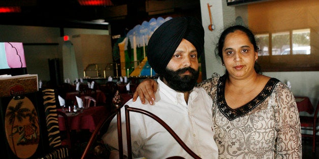 ** ADVANCE FOR RELEASE SUNDAY, MAY 18, 2008 AND THEREAFTER **Rana Singh Sodhi, left, and his wife Sukhbir Kaur stand inside the family restaurant, as the two talk about the loss of Rana's brother, Balbir Singh Sodhi, a Sikh immigrant who was fatally shot in the post-Sept. 11 backlash, and the new PBS documentary film, "A Dream in Doubt," about the death of his brother, Wednesday, April 30, 2008, in Mesa, Ariz. (AP Photo/Ross D. Franklin)