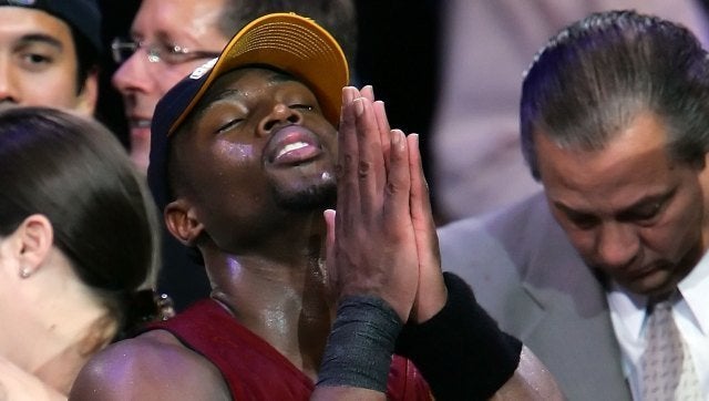 DALLAS - JUNE 20: Dwyane Wade #3 of the Miami Heat prays after the Heat won the 2006 NBA Finals after defeating the Dallas Mavericks 95-92 on June 20, 2006 at American Airlines Center in Dallas, Texas. NOTE TO USER: User expressly acknowledges and agrees that, by downloading and or using this photograph, User is consenting to the terms and conditions of the Getty Images License Agreement. (Photo by Lisa Blumenfeld/Getty Images)