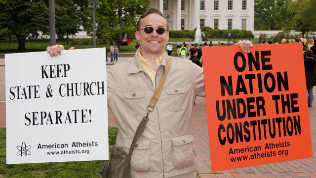 Jeff Wismer demonstrates his Atheist viewpoints in front of the White House with several other demonstraters from the American Atheists and Beltway Atheists May 1, 2008 in front of the White House in Washington. AFP Photo/Paul J. Richards (Photo credit should read PAUL J. RICHARDS/AFP/Getty Images)