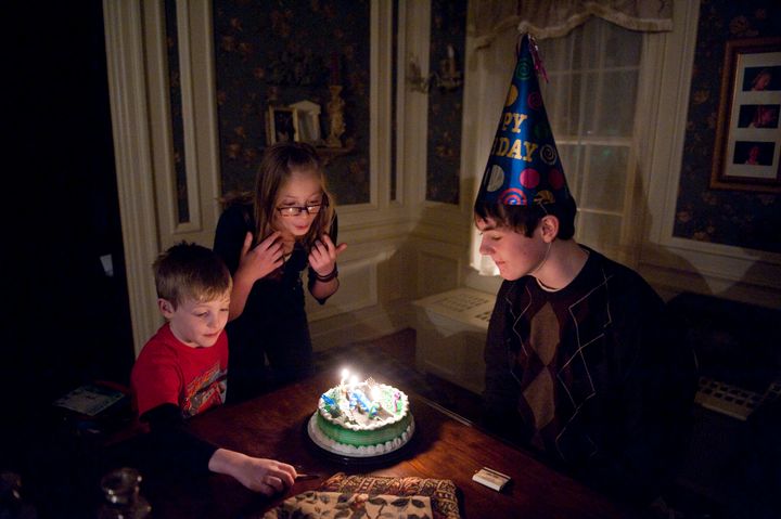 A young man celebrates his birthday with family in Lincoln, Nebraska.