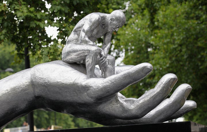 LONDON - AUGUST 21: Lorenzo Quinn's 'Hand of God' sculpture is positioned on Park Lane in Mayfair on August 21, 2011 in London, England. The 4 metre, 400kg aluminium work is also on display at The State Hermitage Museum, Russia. Hand of God forms part of Lorenzo Quinn's 2011 worldwide public art programme which includes The State Hermitage Museum, Russia; La Biennale di Scultura, Rome; and the 54th International Art Exhibition, Venice Biennale. (Photo by Chris Jackson/Getty Images for Halcyon Gallery)