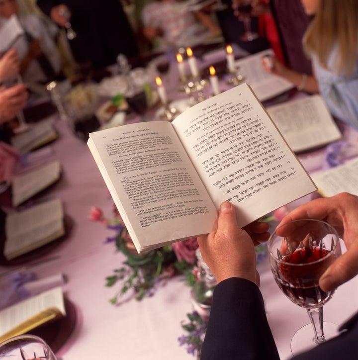 Person reading at Passover meal