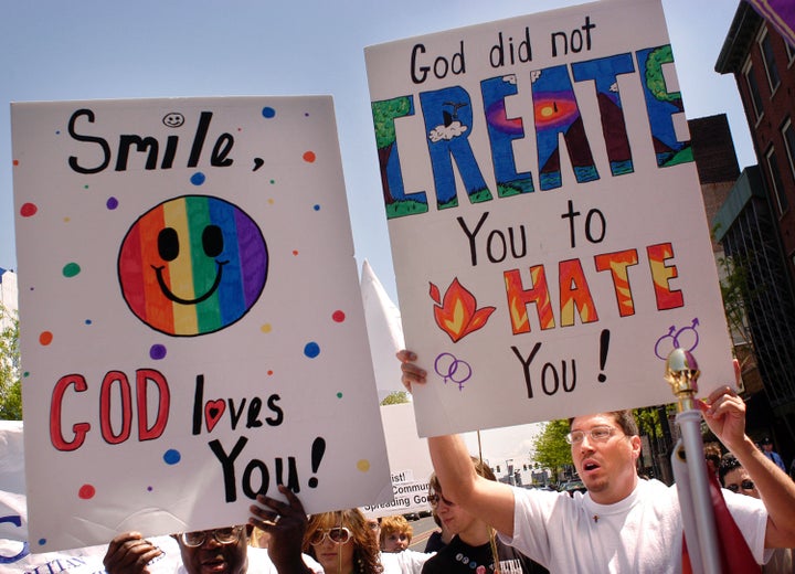 PHILADELPHIA - MAY 1: Activists display signs as they march in support of gay rights during Equality Forum's 40th anniversary celebration of the gay rights movement May 1, 2005 in Philadelphia, Pennsylvania. Thousands attended the weeklong event which ended with the National Celebration at Independence Mall, where the gay rights movement began 40 years ago with the first out and proud demonstrations. (Photo by William Thomas Cain/Getty Images)